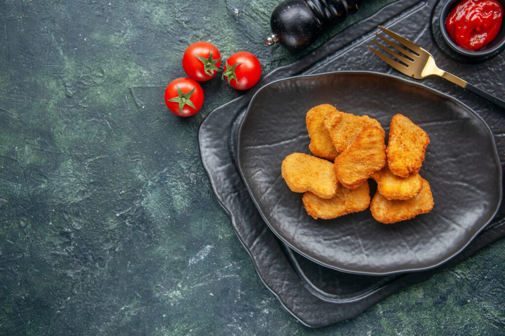 Enjoy crispy, juicy air fryer chicken nuggets with a healthy twist! This easy recipe reduces fat by 75% and delivers flavor in every bite.